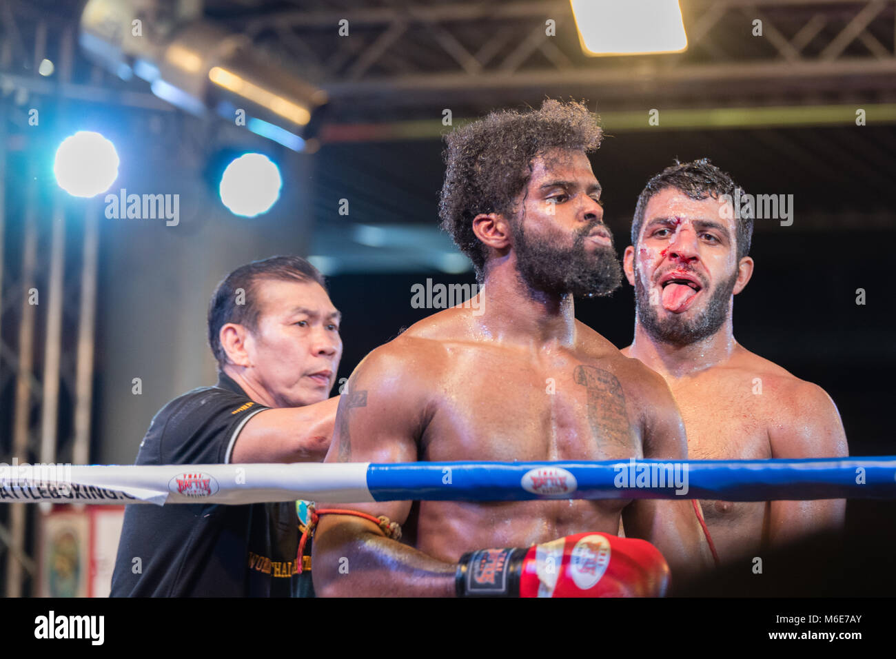 BANGKOK, THAILAND - FEBRUARY 28, 2018: Unidentified fighters compete in an amateur Thai Kickboxing, or Muay Thai, match at MBK Fight Night. Stock Photo