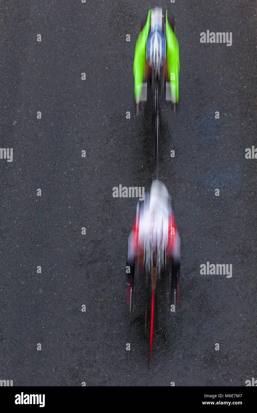 Cycling road race speed blur motion of cyclists and individual unidentified overhead photo. Stock Photo