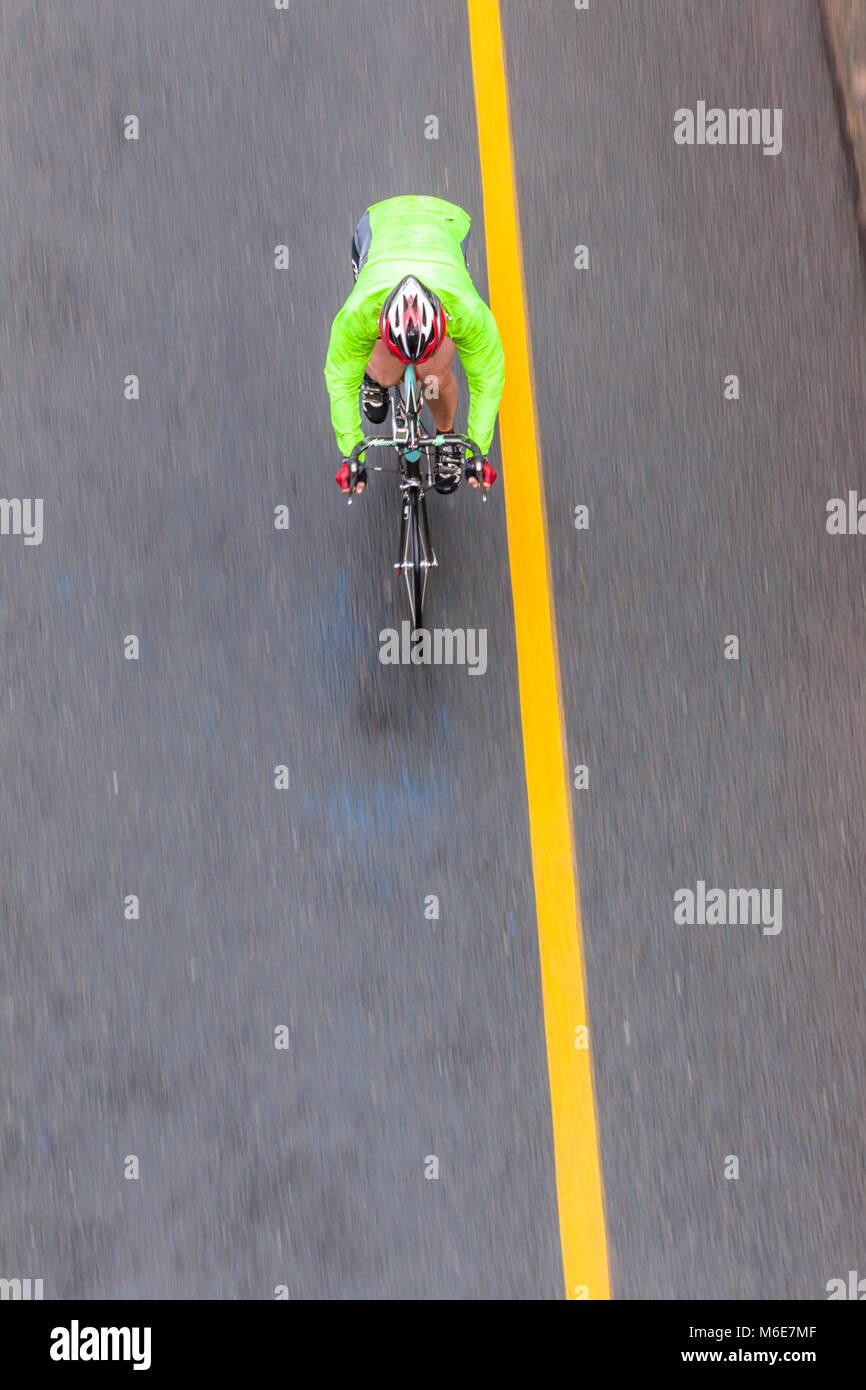 Cycling road race speed blur motion of cyclists and individual unidentified overhead photo. Stock Photo