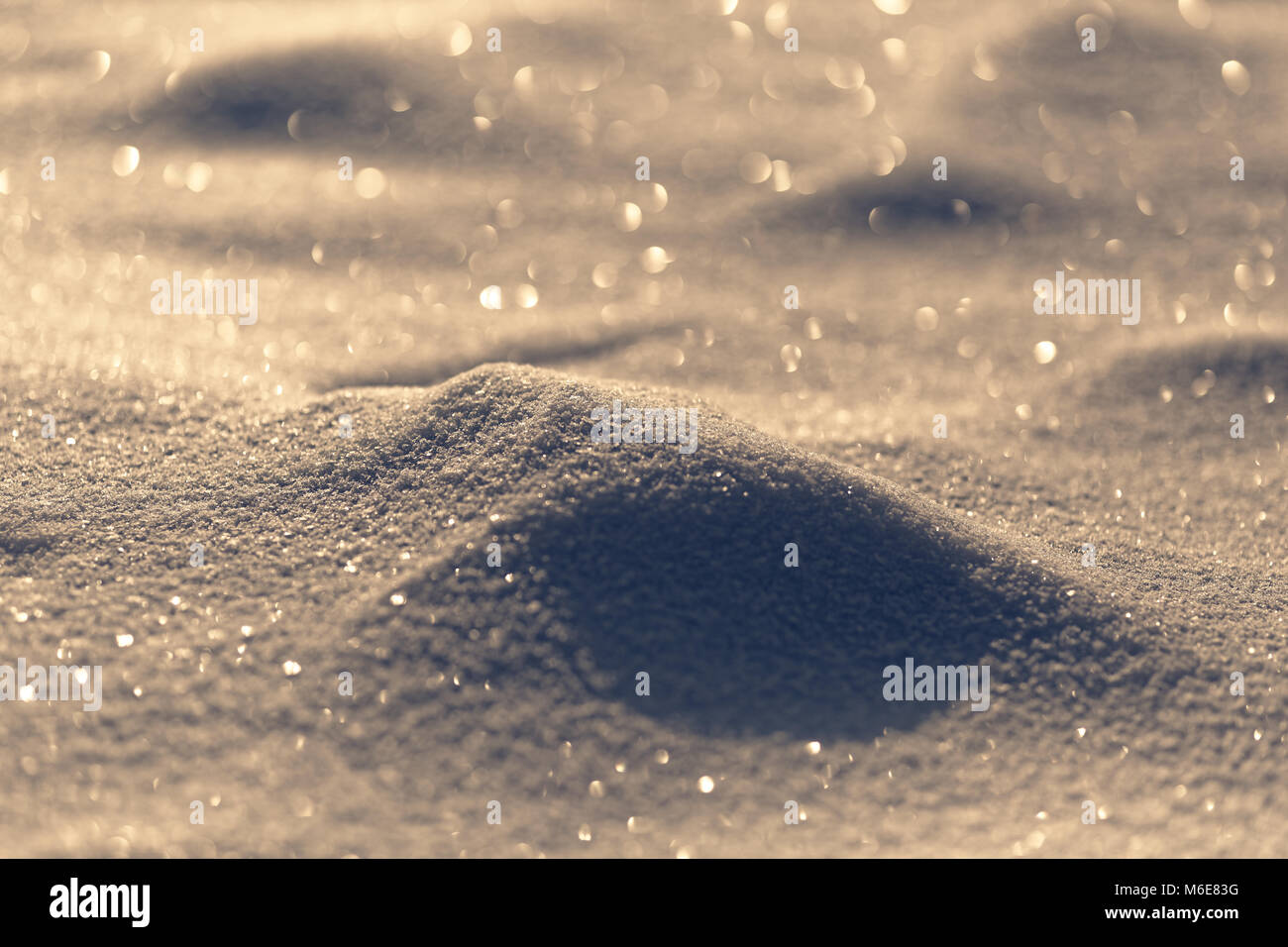 Golden monochrome defocused sparkle snow landscape Stock Photo