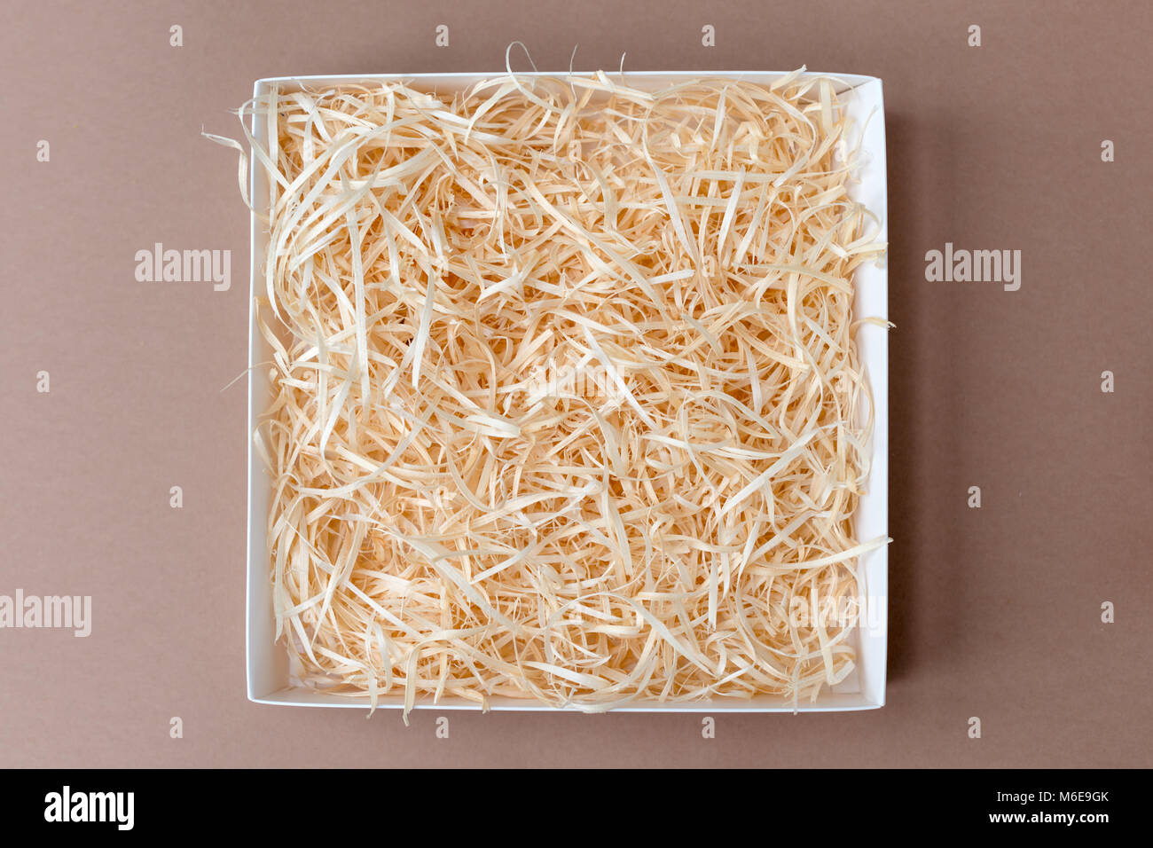 Opened gift box with decorative straw, filler, shavings Stock Photo Alamy