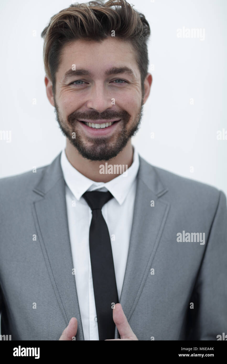 handsome young man in suit on grey background Stock Photo - Alamy