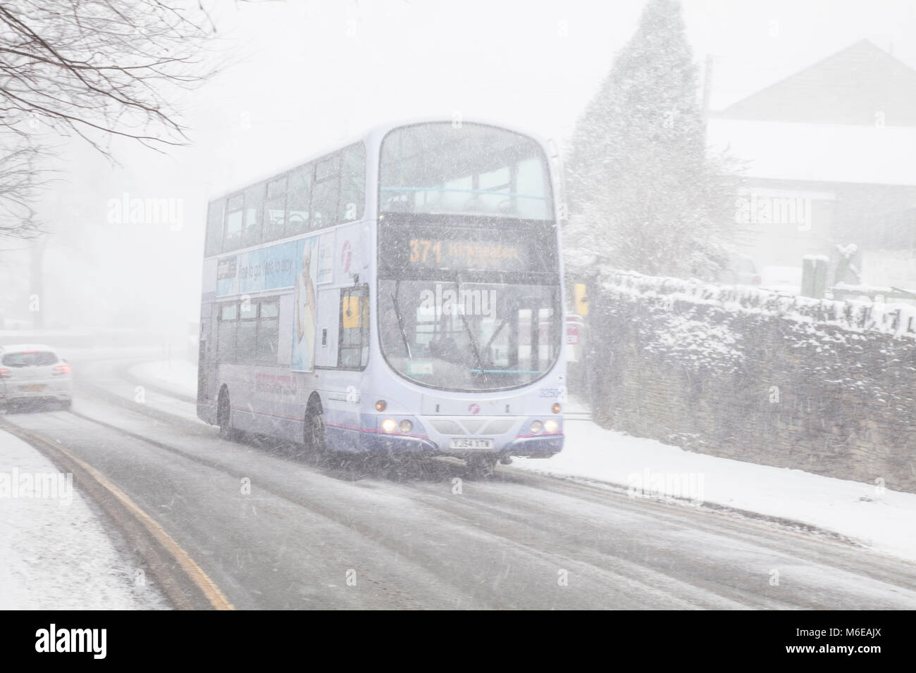 English double decker bus in extreme snow storm Stock Photo