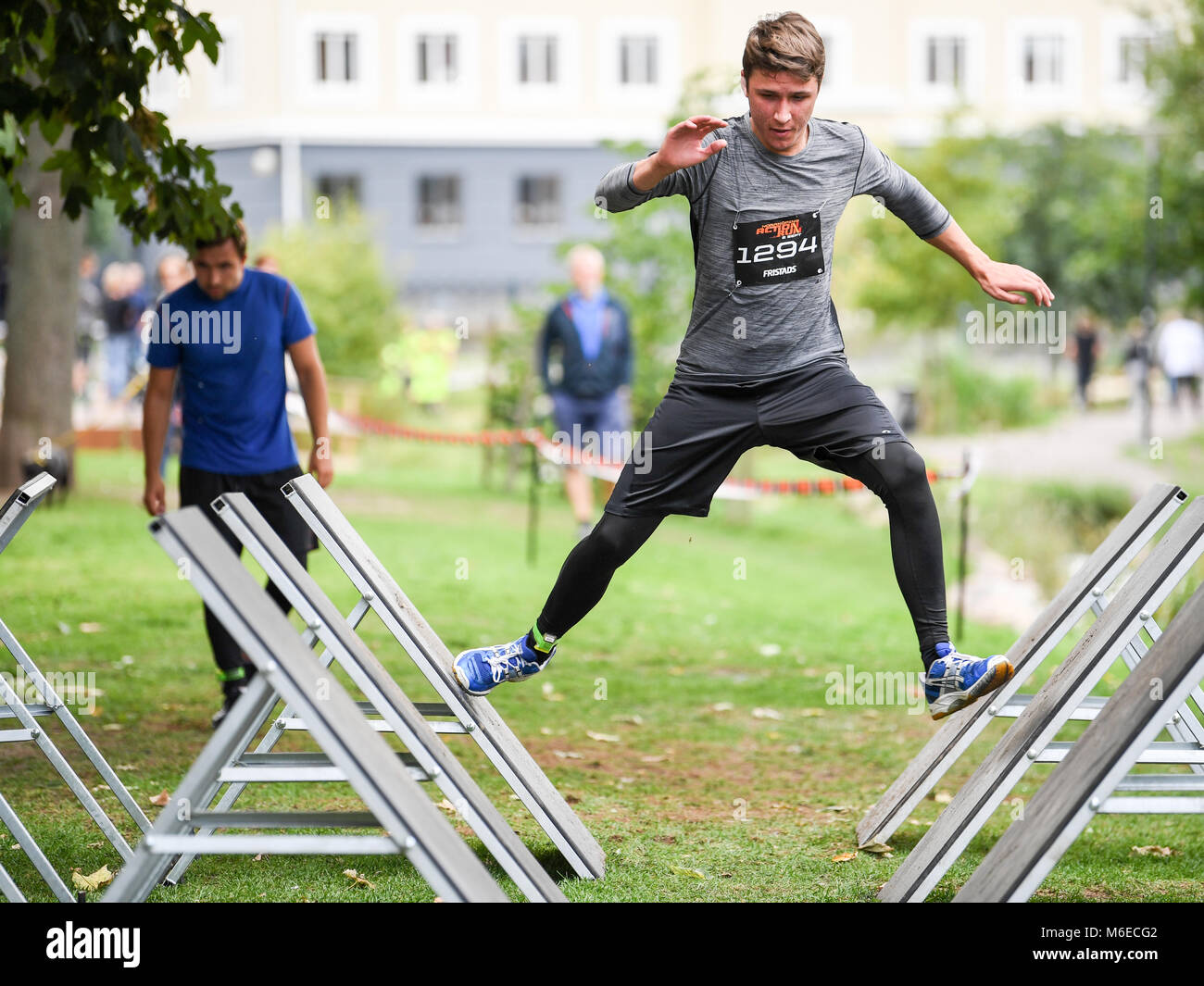 Jumping an obstacle at Action run 2017 obstacle race run in the city of