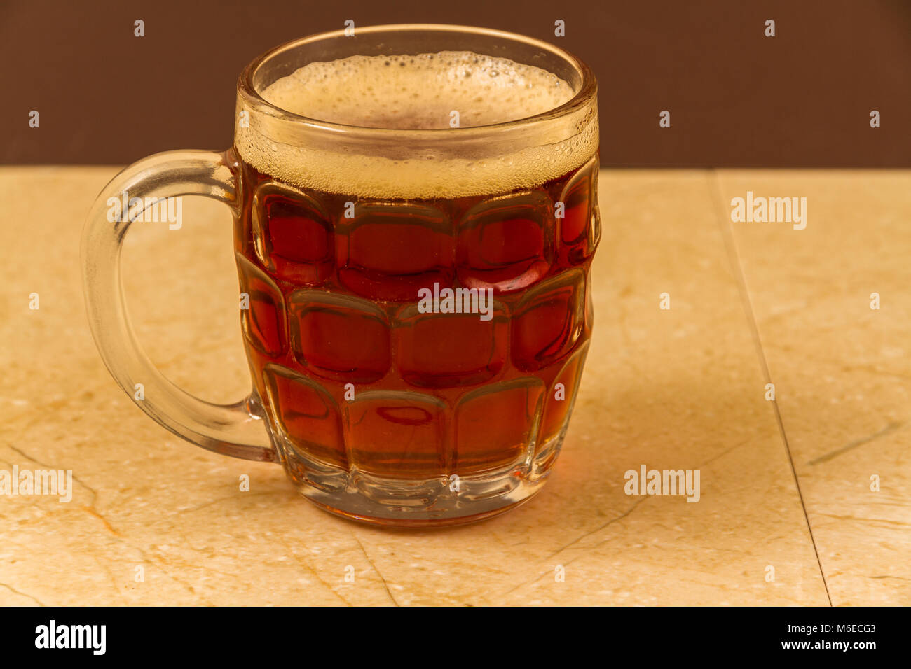 Half pint mug of English beer or ale. Stock Photo