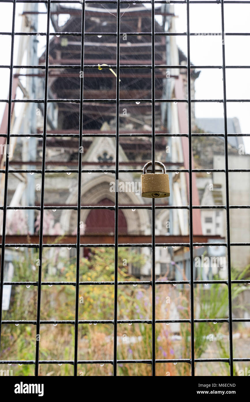 Wire Mesh, a Lock and Earthquake Damage to Cathedral, Christchurch, New Zealand Stock Photo