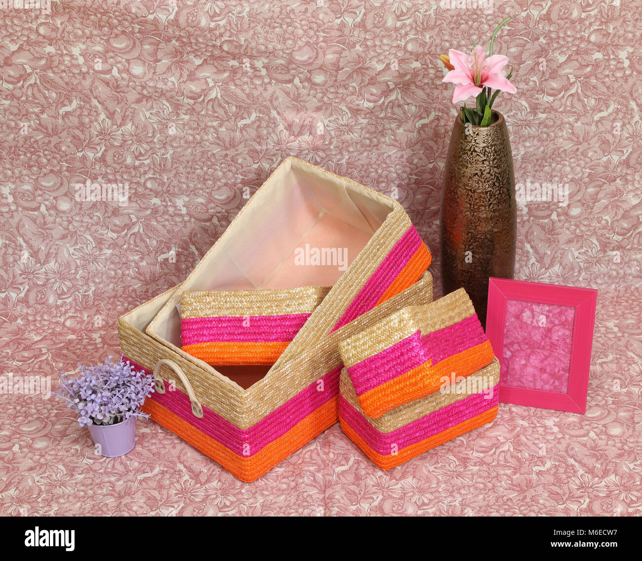 Colorful Ratten Basket Assortment of colorful rattan baskets with pink flower Stock Photo - Alamy