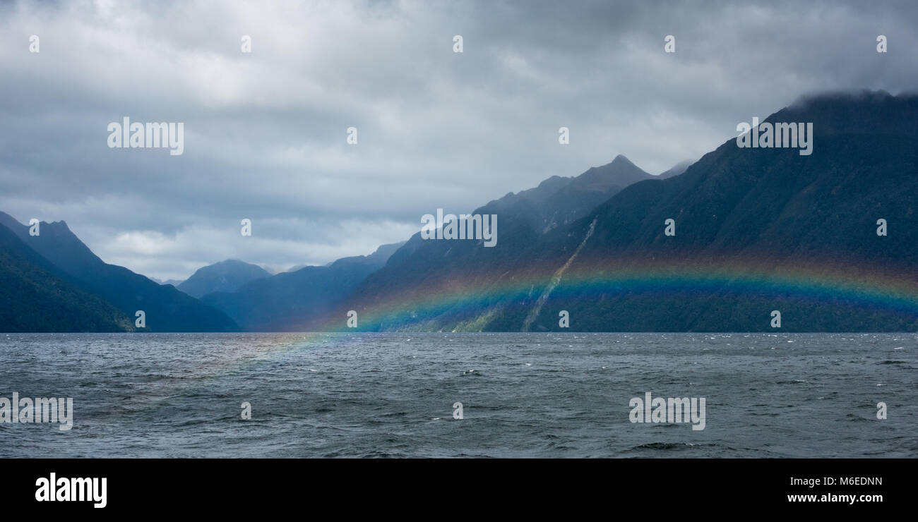 Rainbow across Lake Manapouri, South Island, New Zealand Stock Photo ...