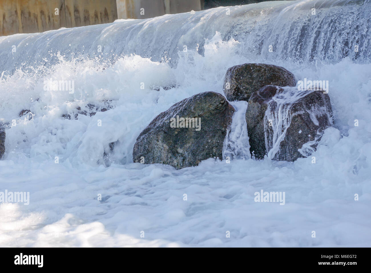 Small artificial water fall from water treatment pland. Water coming