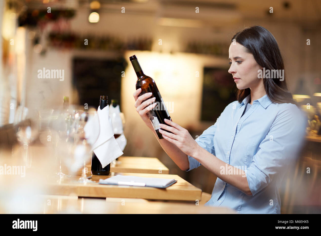 Examining the wine Stock Photo - Alamy