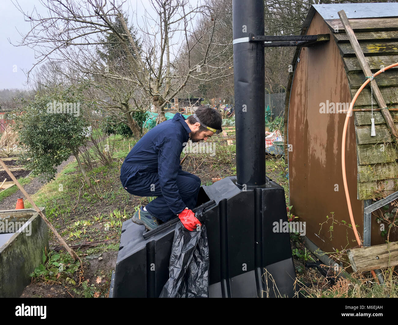 A service engineer from the composting toilet maintenance company ETS