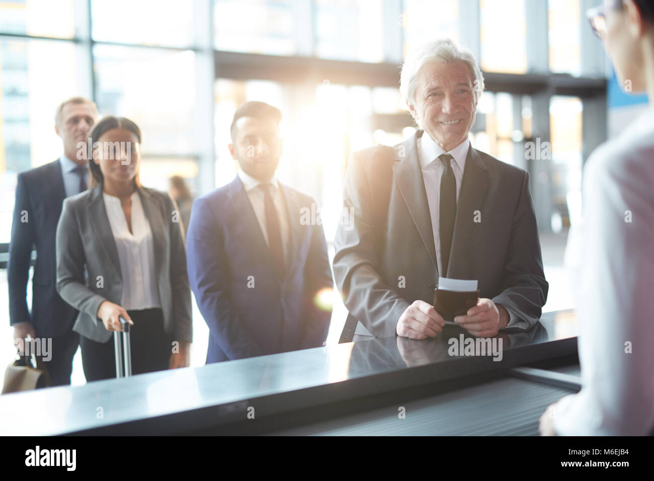 Agent checking passport hi-res stock photography and images - Alamy