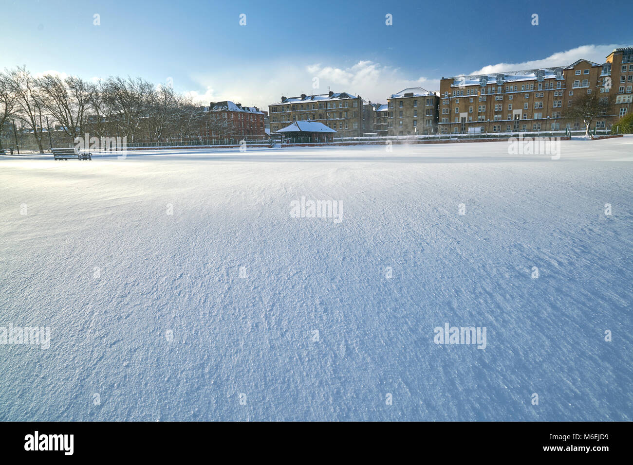 Bowling green covered in deep snow after blizzard in Glasgow, Scotland. Stock Photo