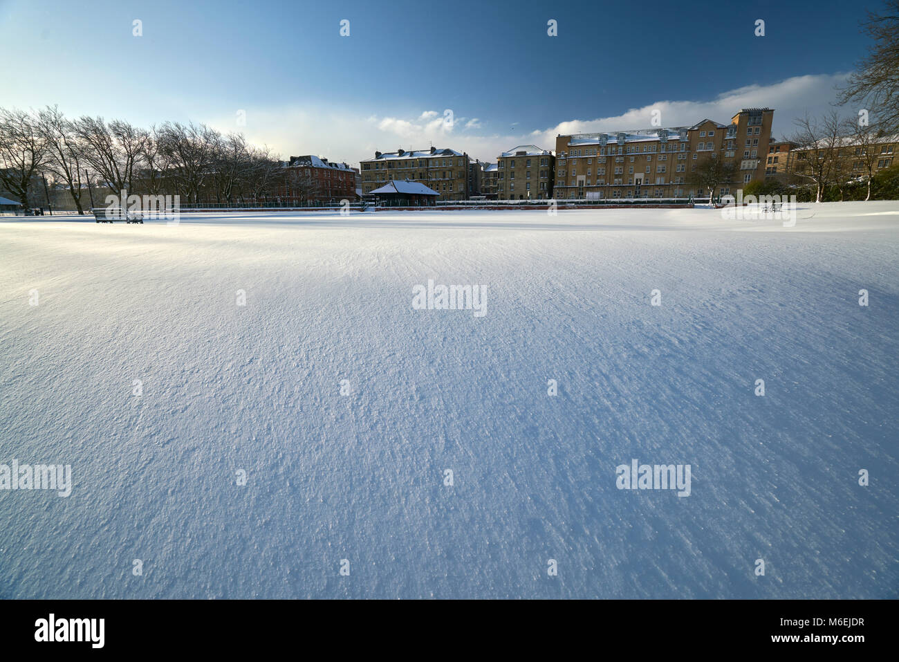 Bowling green covered in deep snow after blizzard in Glasgow, Scotland. Stock Photo
