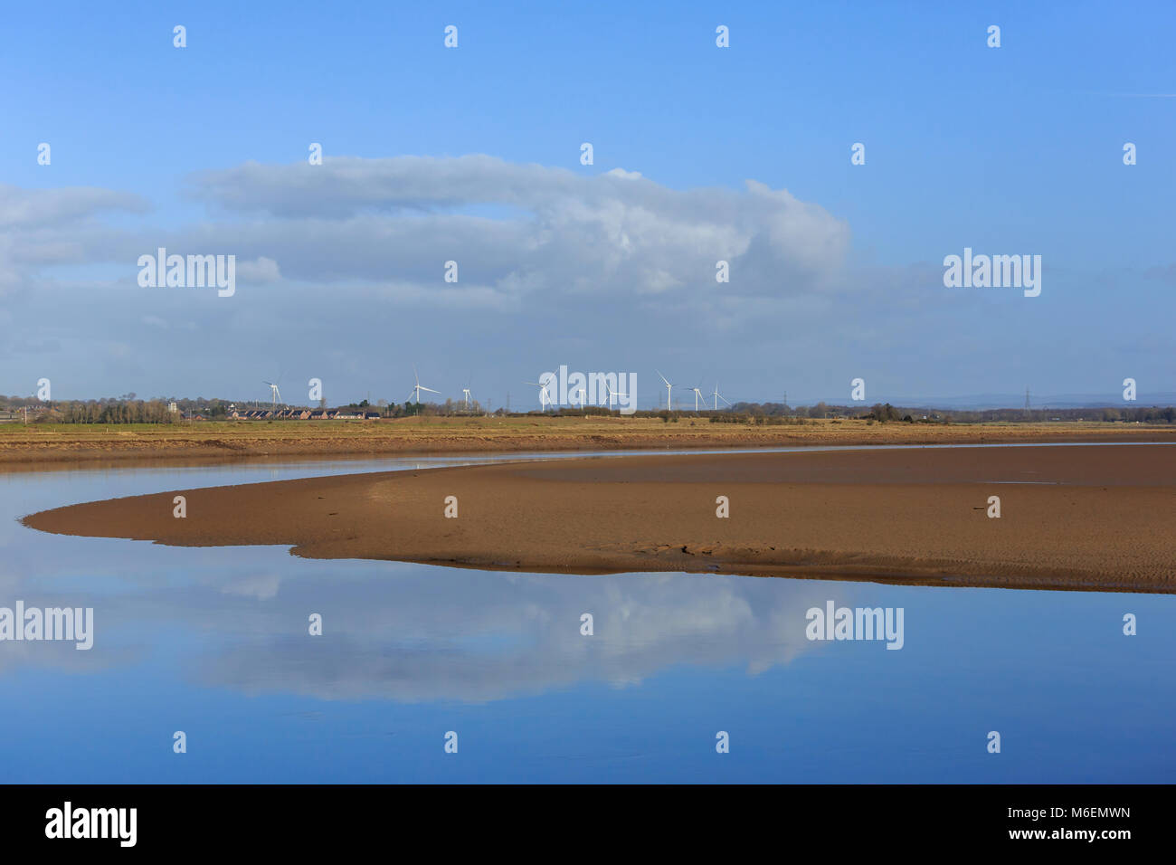 View of cloud reflections on the Solway Estuary shore line Scotland Stock Photo