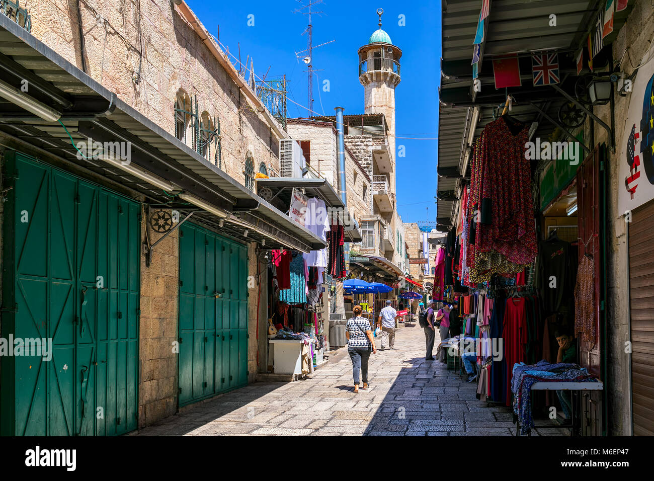 JERUSALEM, ISRAEL - JULY 16, 2017: Narrow street among small shops of famous bazaar - market in Old City of Jerusalem, very popular destination with l Stock Photo