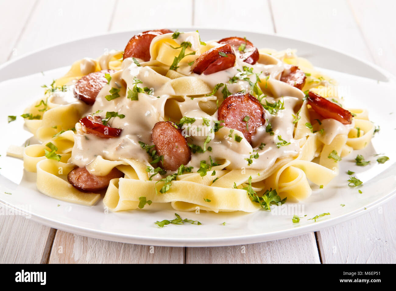 Pasta with sausages and vegetables Stock Photo Alamy
