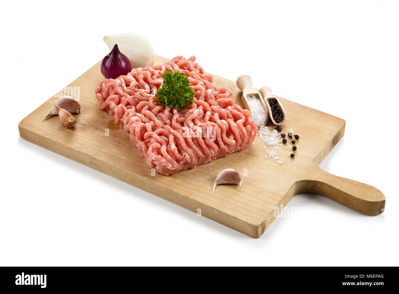 Raw minced pork on cutting board and vegetables Stock Photo