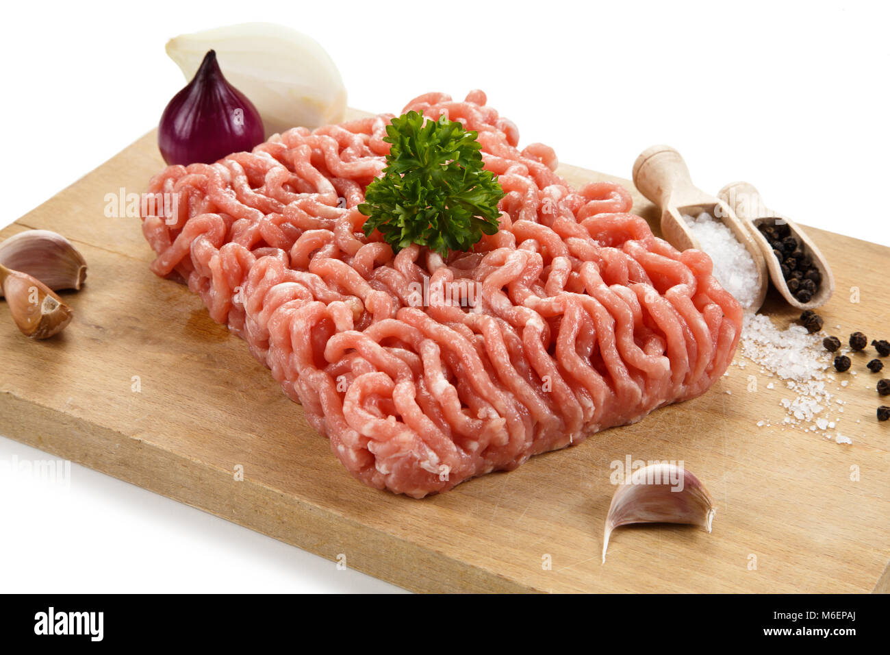 Raw minced pork on cutting board and vegetables Stock Photo