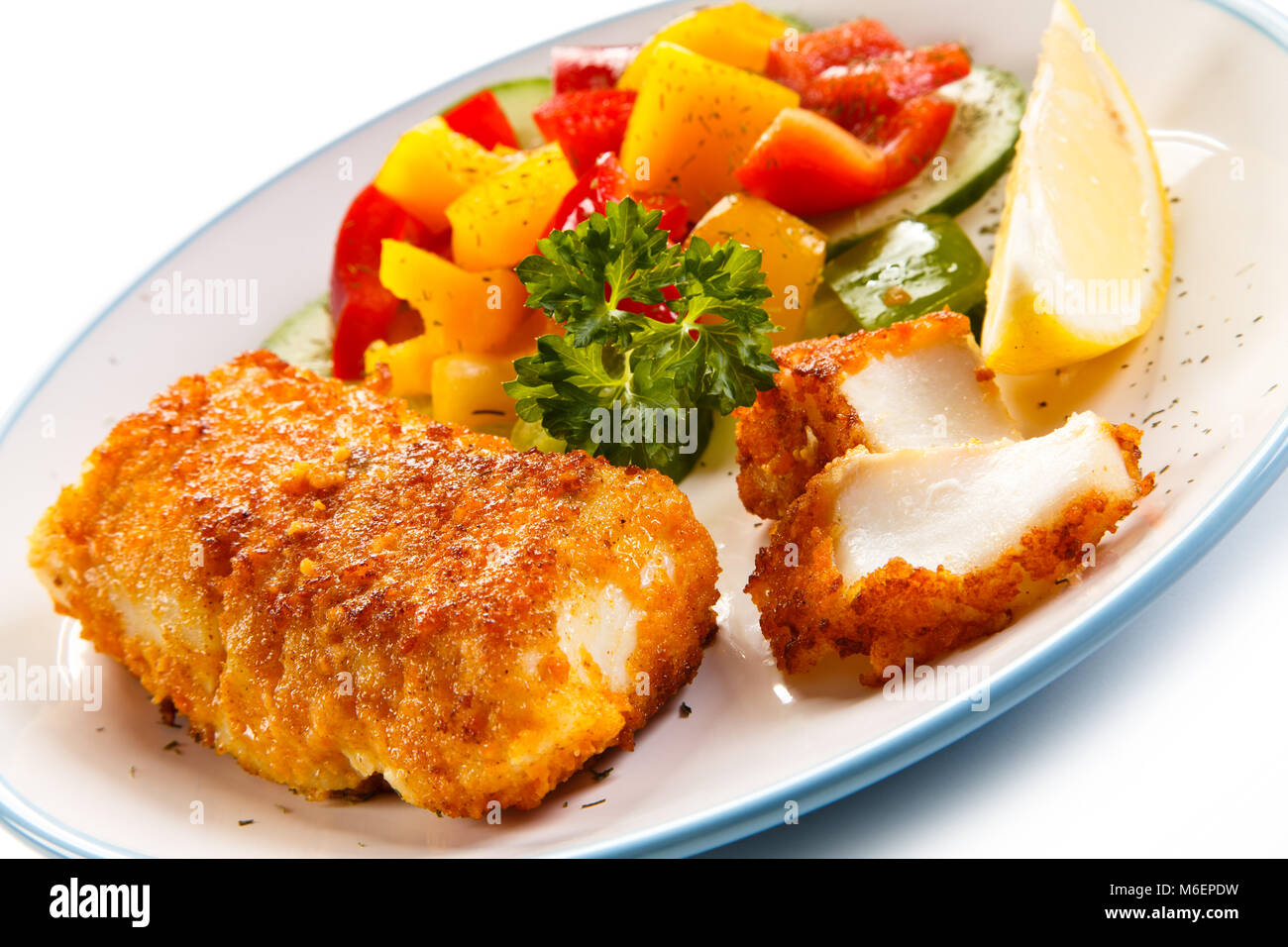 Fish dish fried fish fillets and vegetables Stock Photo Alamy