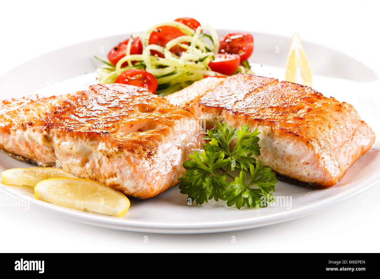Grilled salmon and vegetables on white background Stock Photo - Alamy