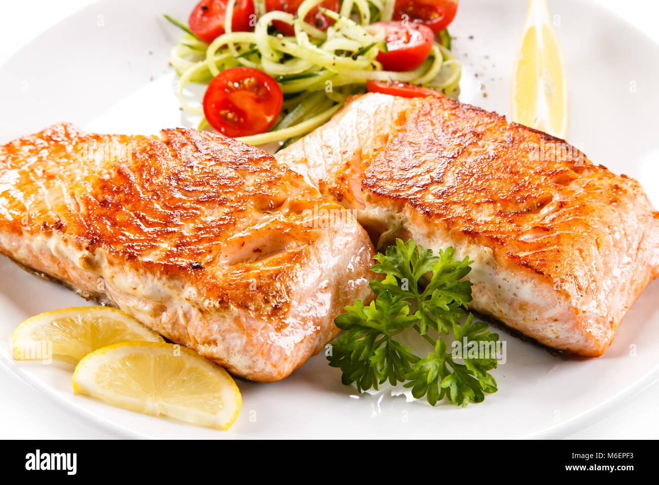 Grilled salmon and vegetables on white background Stock Photo - Alamy