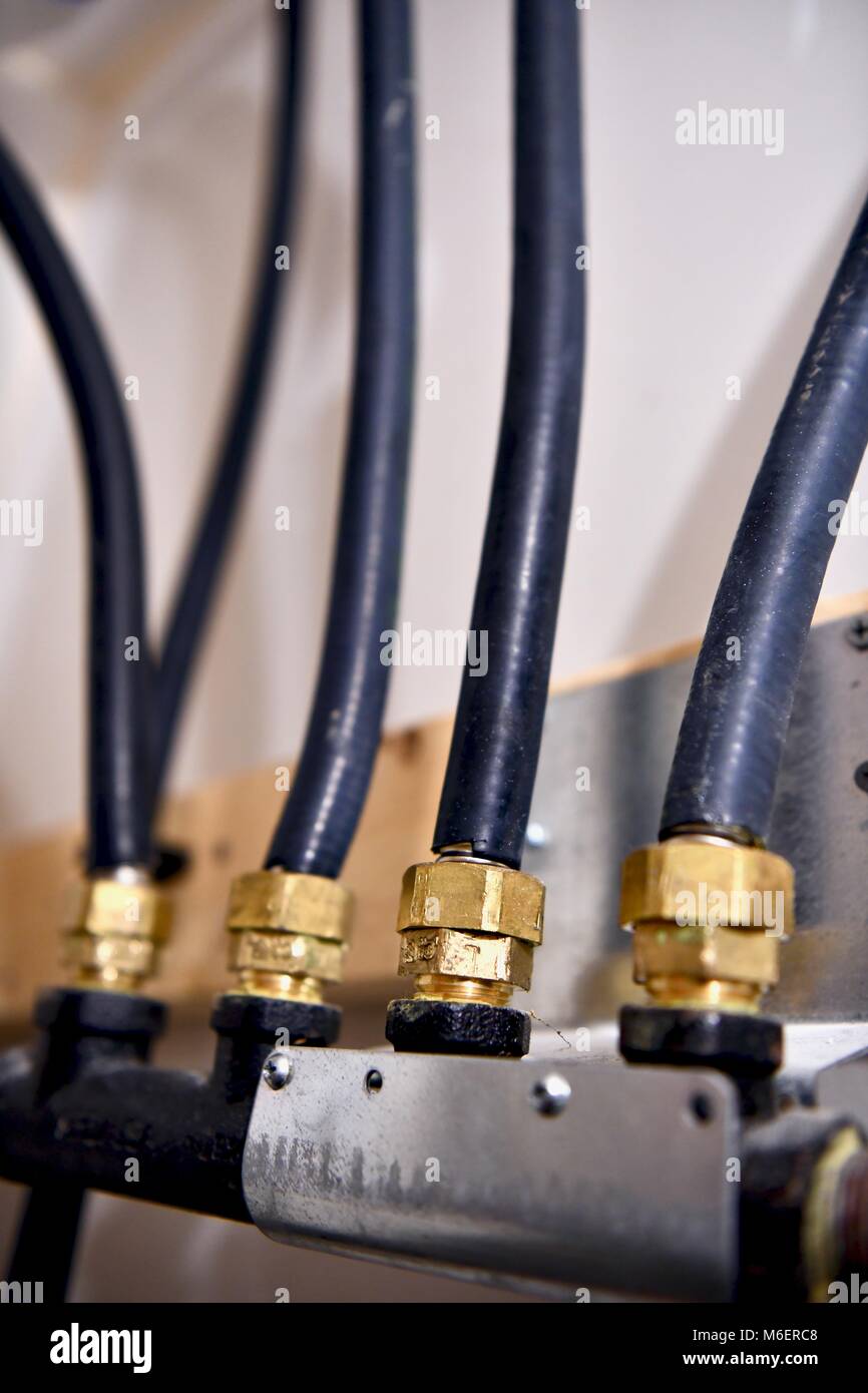 Natural gas lines running to the water heater and furnace of a