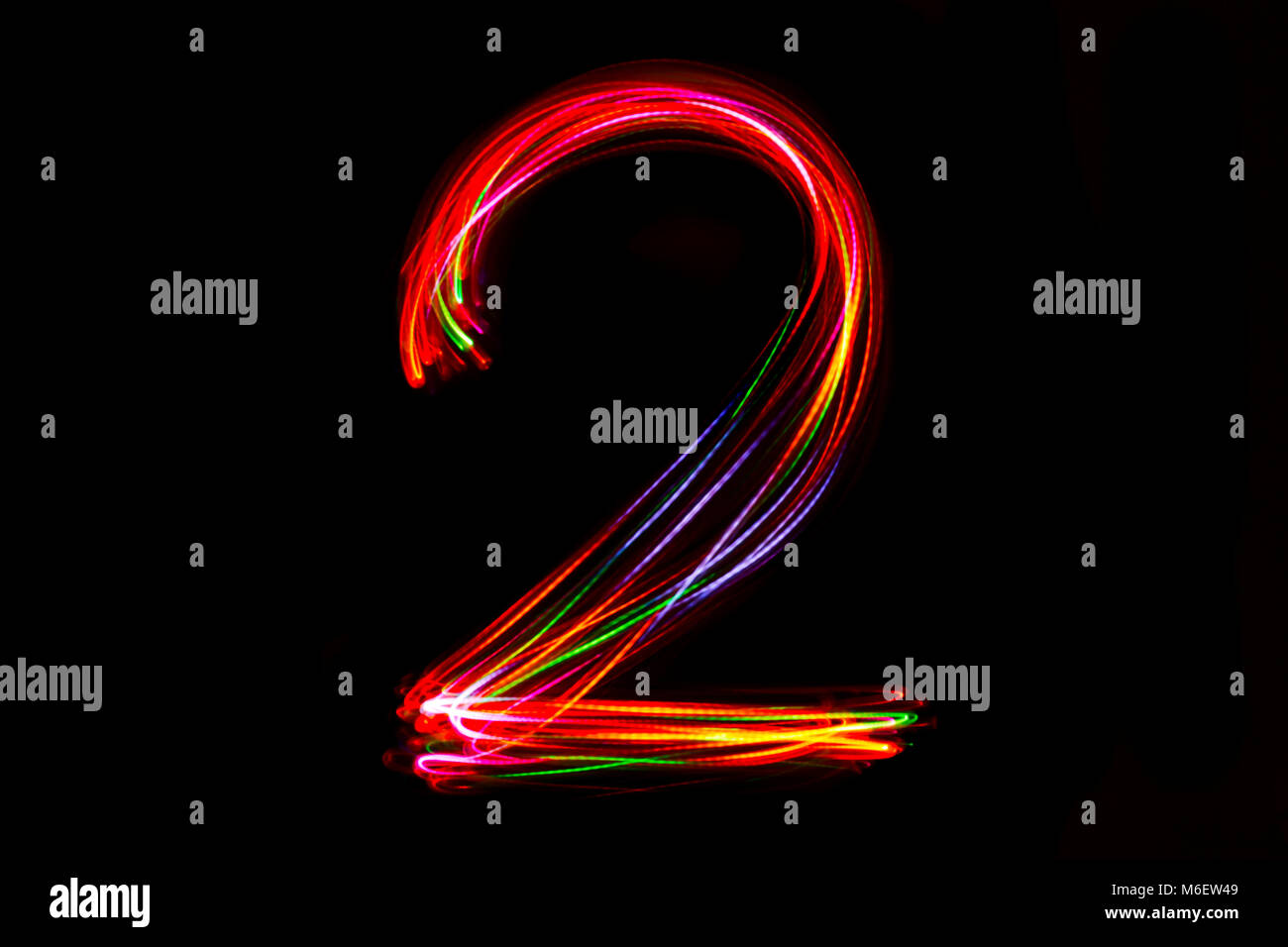Blurred word writing from light on the black background Stock Photo Alamy