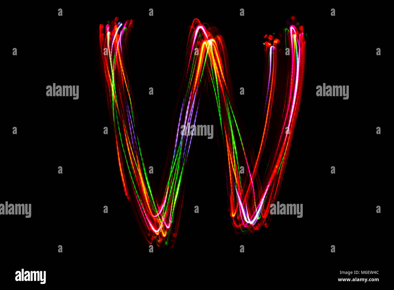 Blurred word writing from light on the black background Stock Photo Alamy