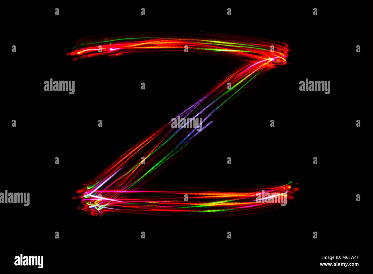 Blurred word writing from light on the black background Stock Photo Alamy