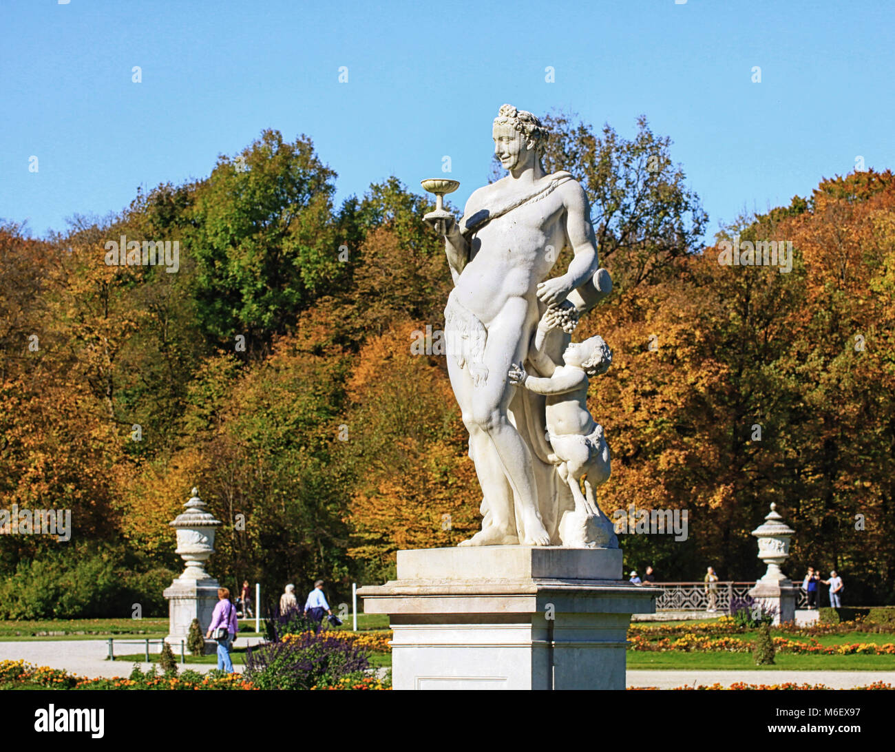 MUNICH, GERMANY - OCTOBER 16, 2017  - Nymphemburg palace gardens in Munich: mythological statue of Roman god of wine Bacchus, by Roman Anton Boos, yea Stock Photo