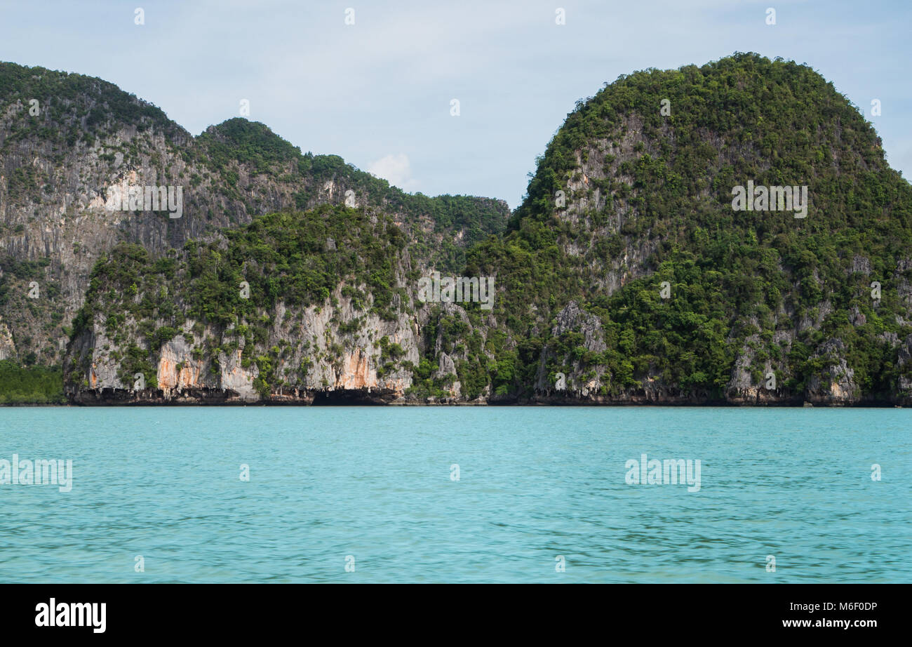 Cave forming a tunnel under a small island in the Phang Nga Bay in Thailand Stock Photo