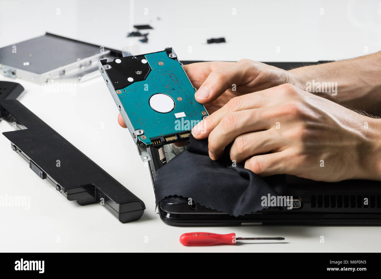 Cleaning computer hardware with cloth Stock Photo