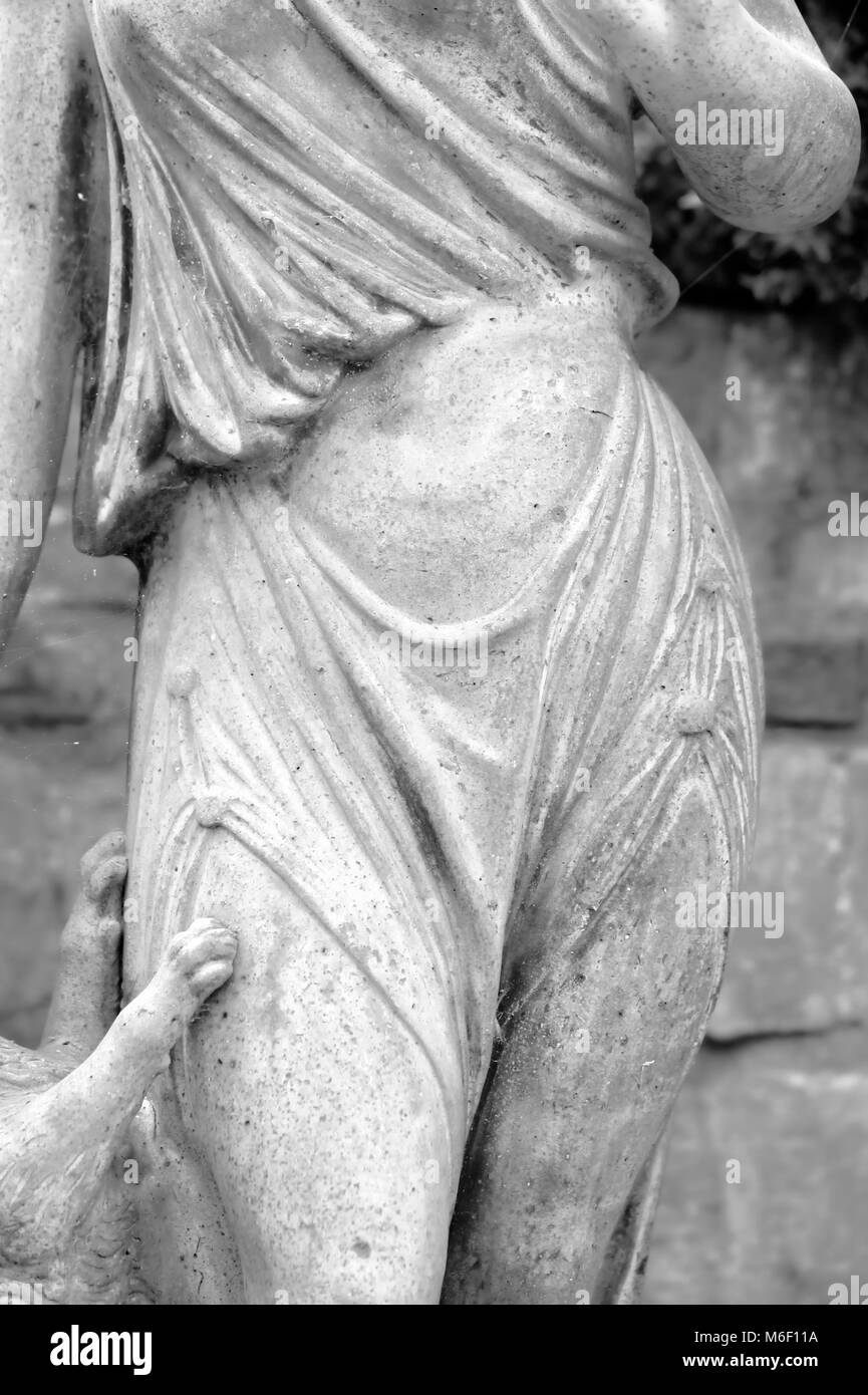 Female statue with dog paws in York Stock Photo Alamy