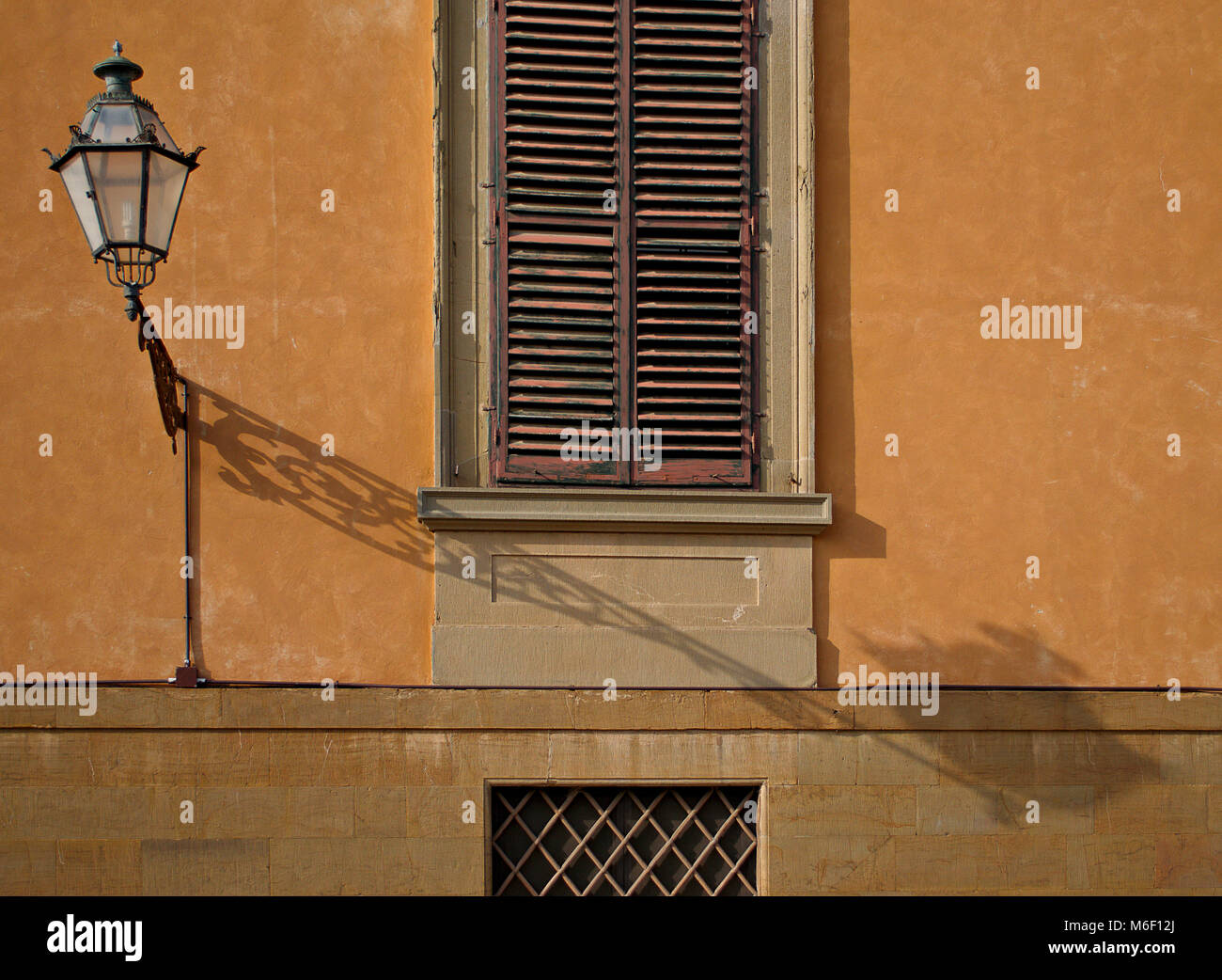 Ornate light on wall at the Pitti Palace, Florence, Italy Stock Photo