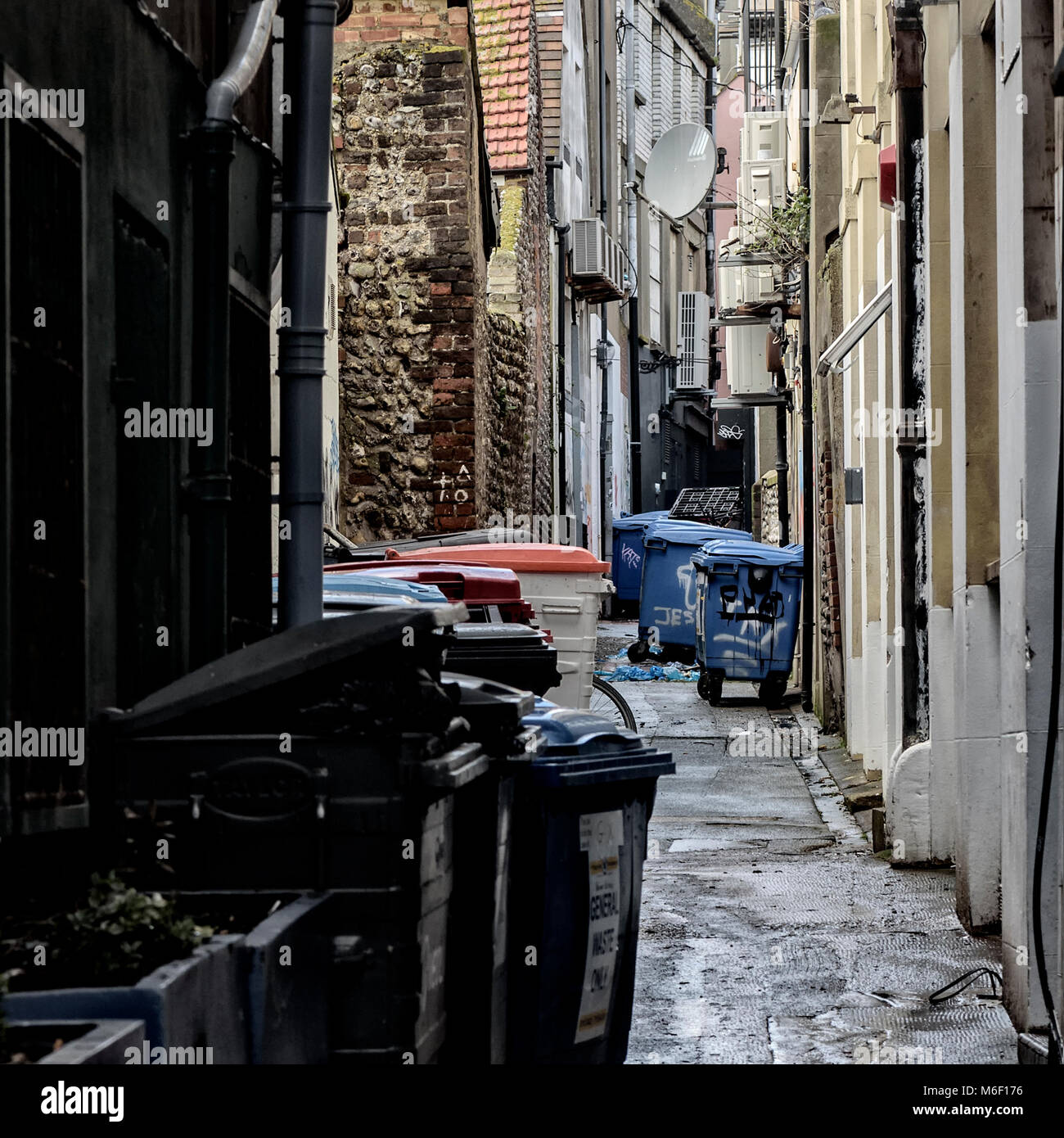 Dustbin alley in Brighton Stock Photo