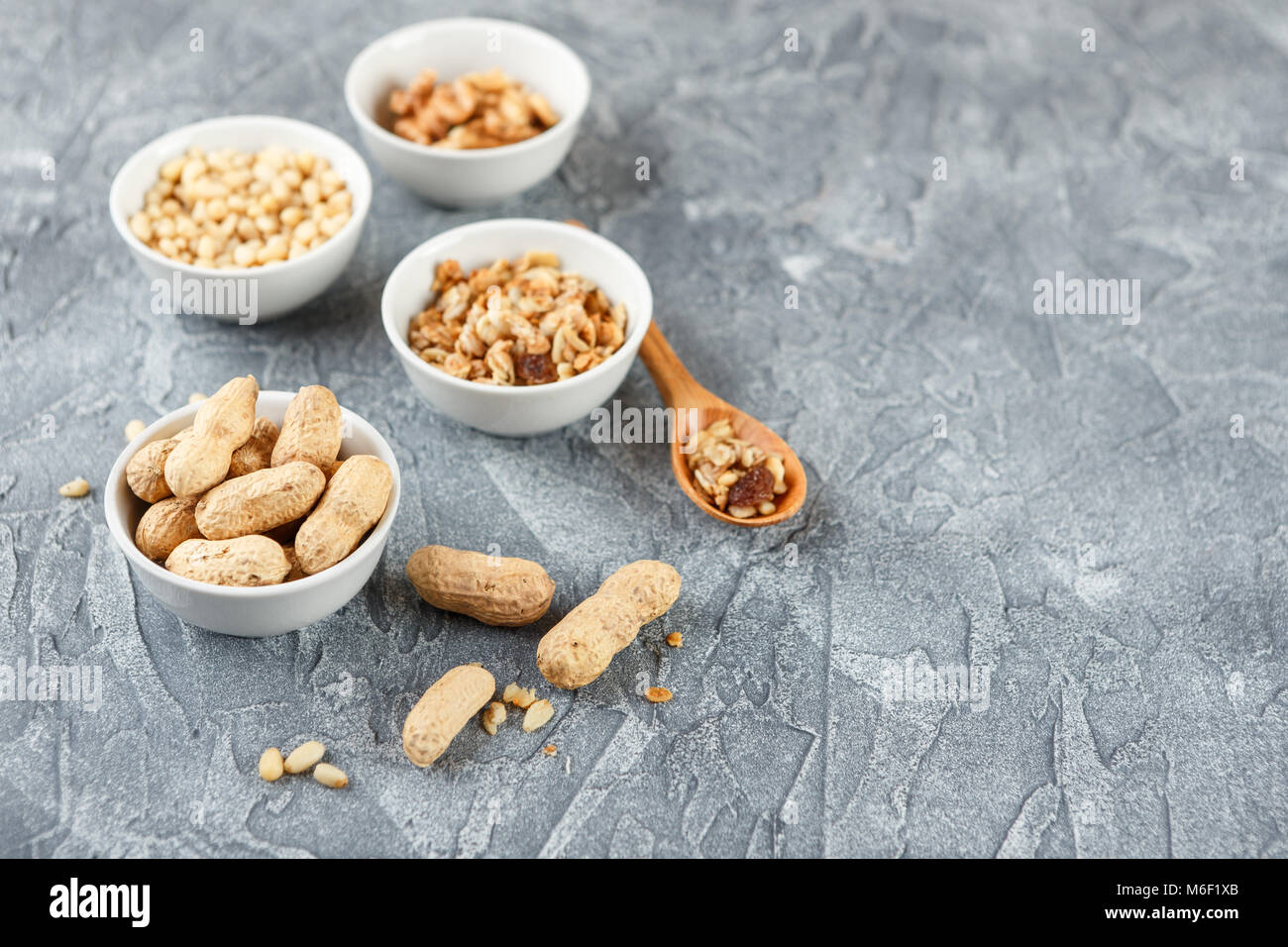 Set of different types of nuts peanuts in shells, pine nuts and