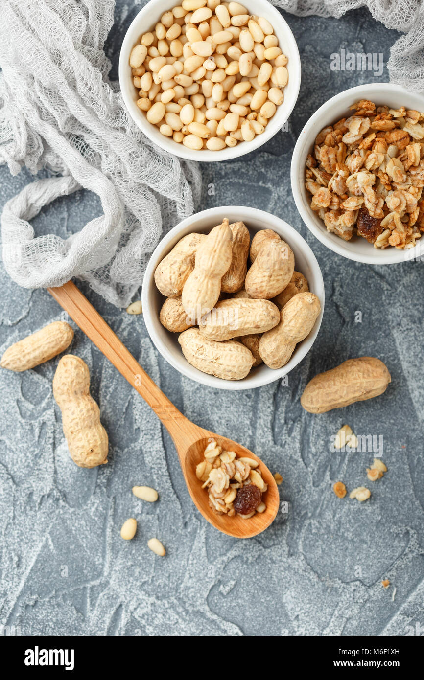 Set of different types of nuts peanuts in shells, pine nuts and