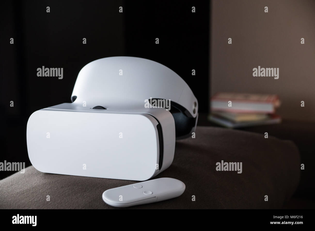 VR headset in the room with books behind it Stock Photo