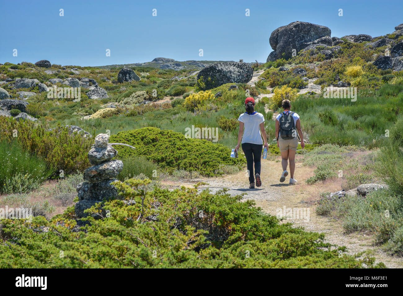 two women doing hiking on the mountain Stock Photo - Alamy