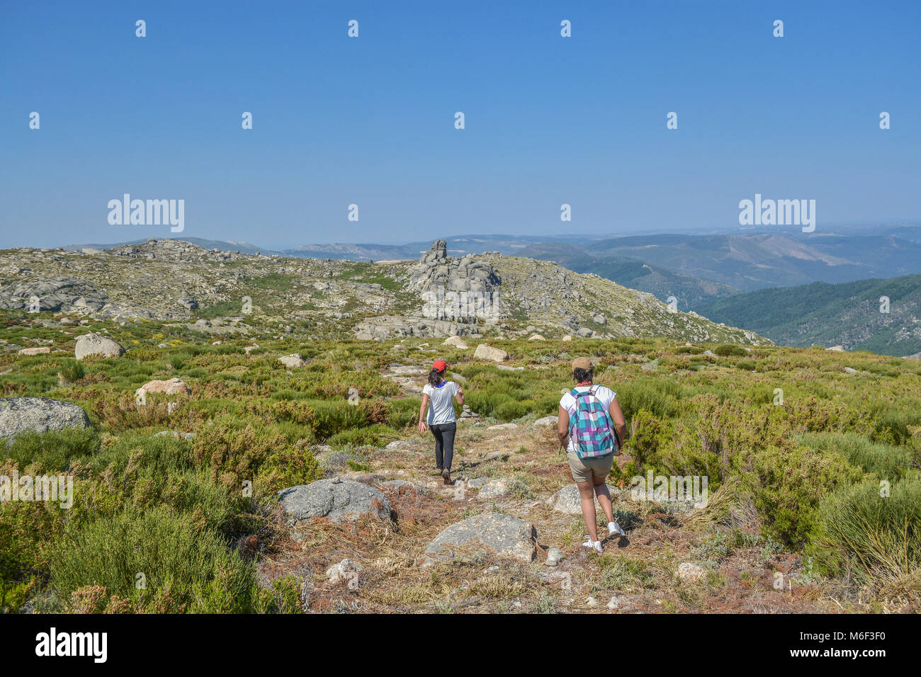 two women doing hiking on the mountain Stock Photo - Alamy