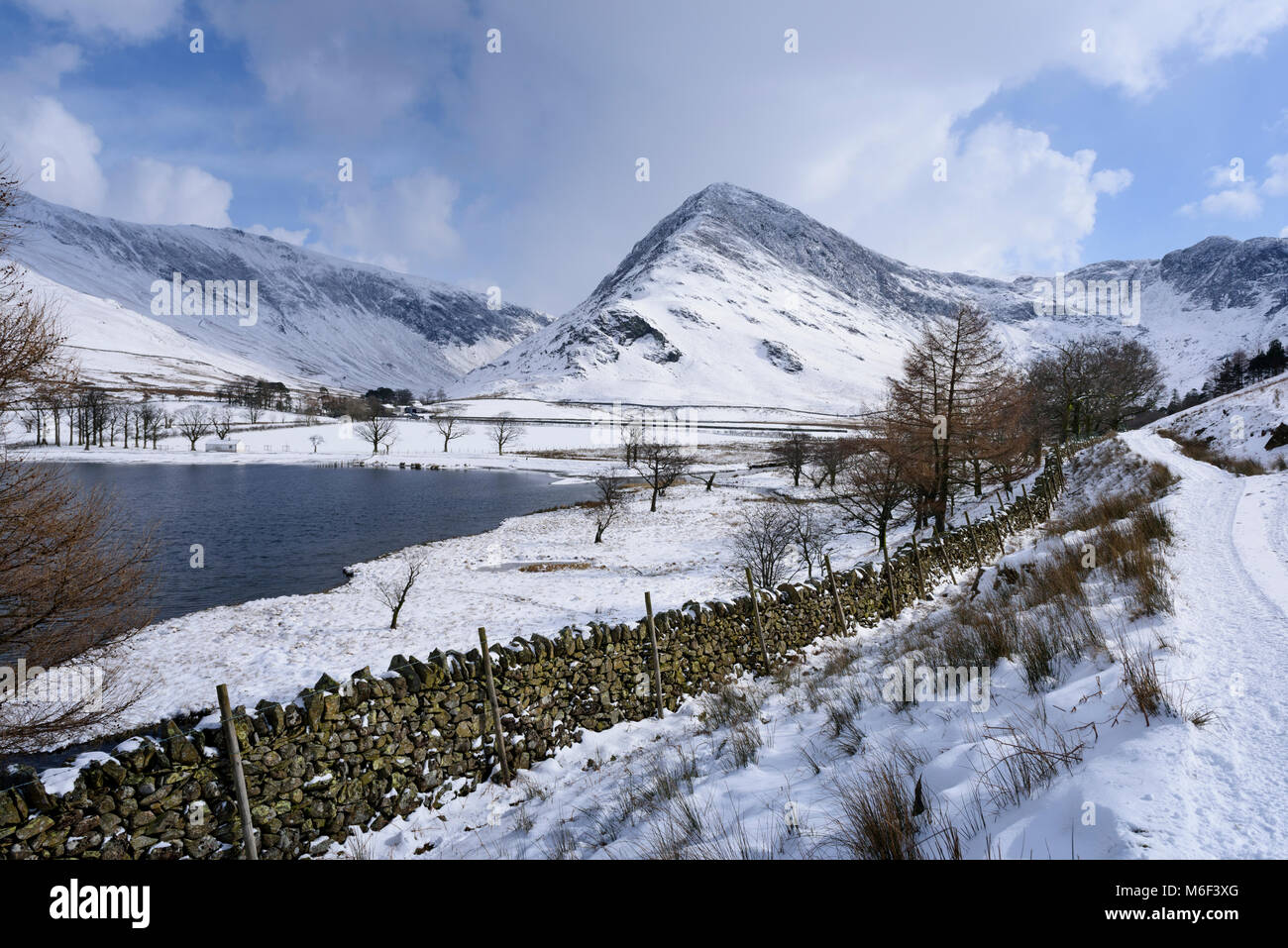Buttermere lake in the English Lake District in winter, fells in view include Fleetwith Pike Stock Photo
