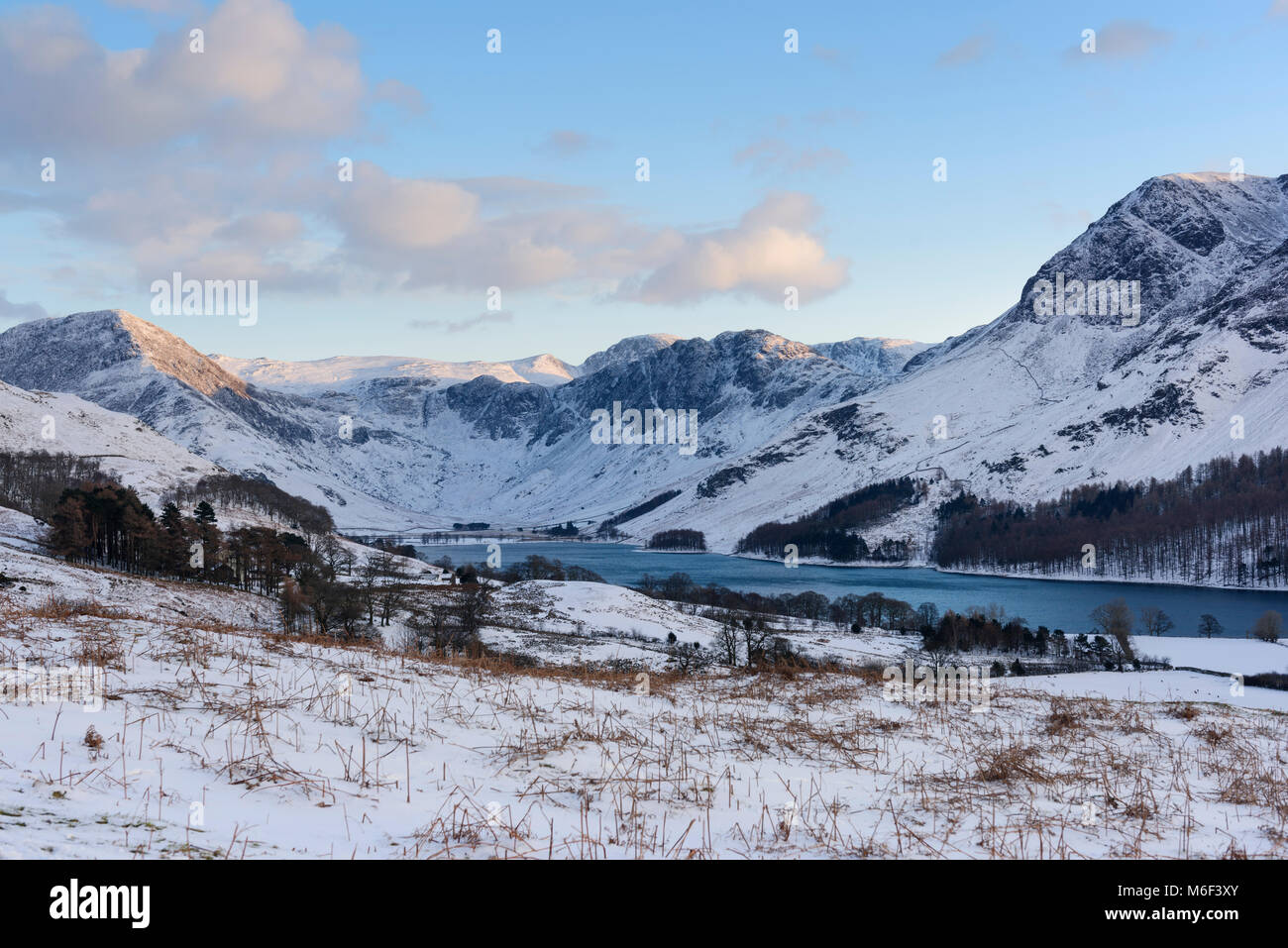 Buttermere lake in the English Lake District in winter, fells in view include Fleetwith Pike,  Haystacks and High Stile Stock Photo