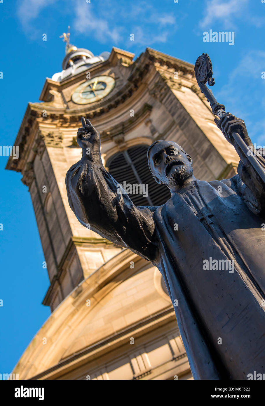 The bronze statue of Charles Gore, 1st Bishop of Birmingham stands outside St. Philip's Cathedral, Birmingham, West Midlands, England, Europe Stock Photo