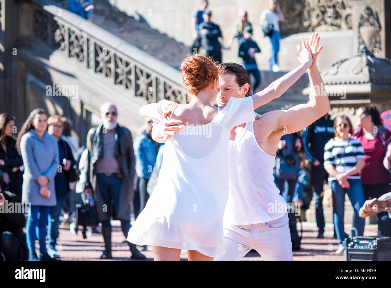 New York City, USA - October 28, 2017: Manhattan NYC Central park at Bethesda Arcade terrace couple of dancers in white clothing young millennials clo Stock Photo