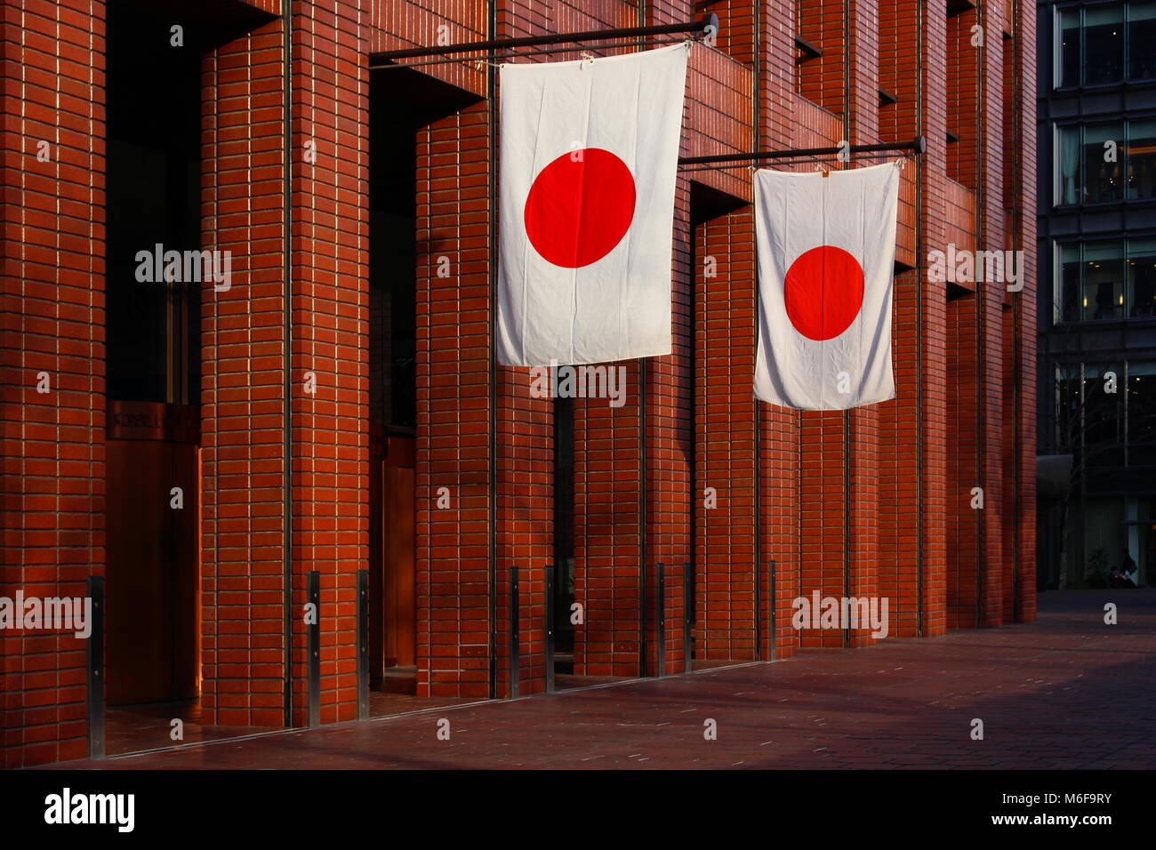 On the weekend of Emperor's birthday, Japanese flags hanging outside the Kunio Maekawadesigned