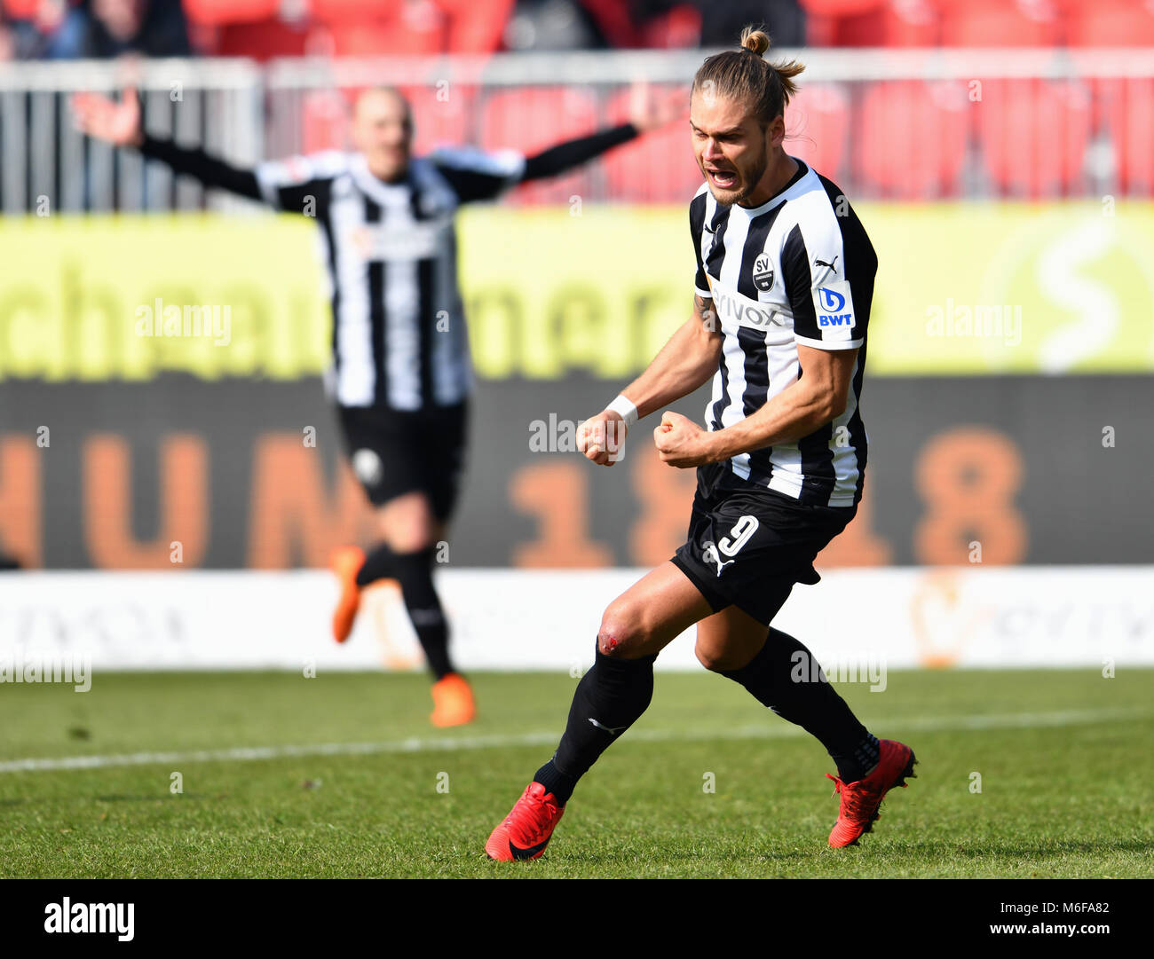Sandhausen, Germany. 3rd March 2018.  Soccer, second Bundesliga, SV Sandhausen vs Erzgebirge Aue, at Hardtwald stadium. Sandhausen's striker Rurik Gislason (R) celebrates his equalising goal bringing the score to 1:1. Photo: Uwe Anspach/dpa - (EMBARGO CONDITIONS - ATTENTION: Due to the accreditation guidelines, the DFL only permits the publication and utilisation of up to 15 pictures per match on the internet and in online media during the match.) Credit: dpa picture alliance/Alamy Live News Stock Photo