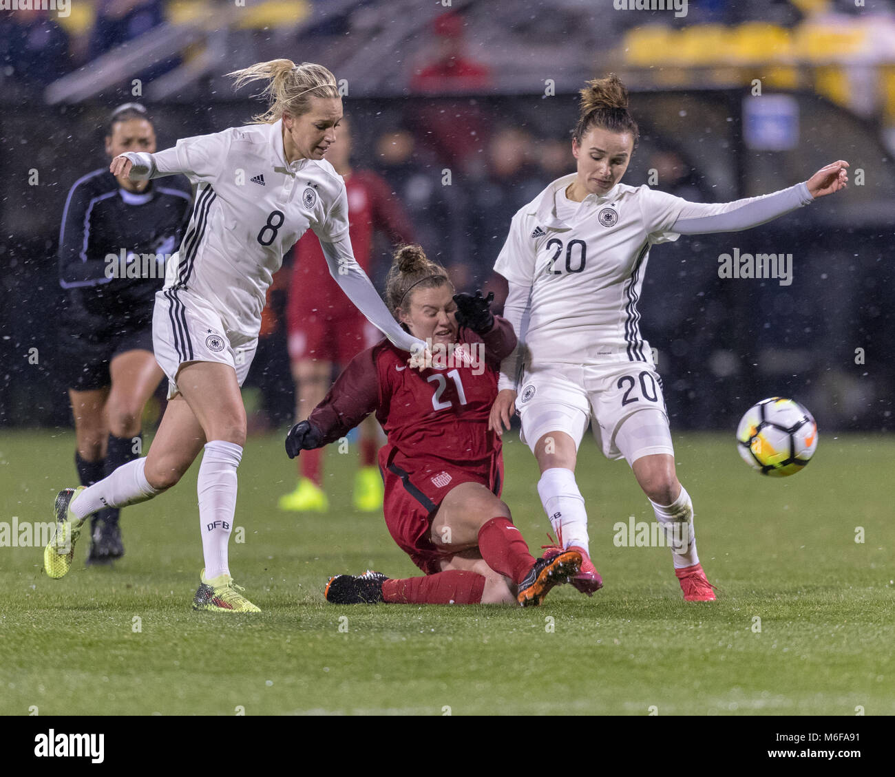 USA FW Savannah McCaskill is fouled by German MF Lena Goeßling but get it through to her teammate Stock Photo