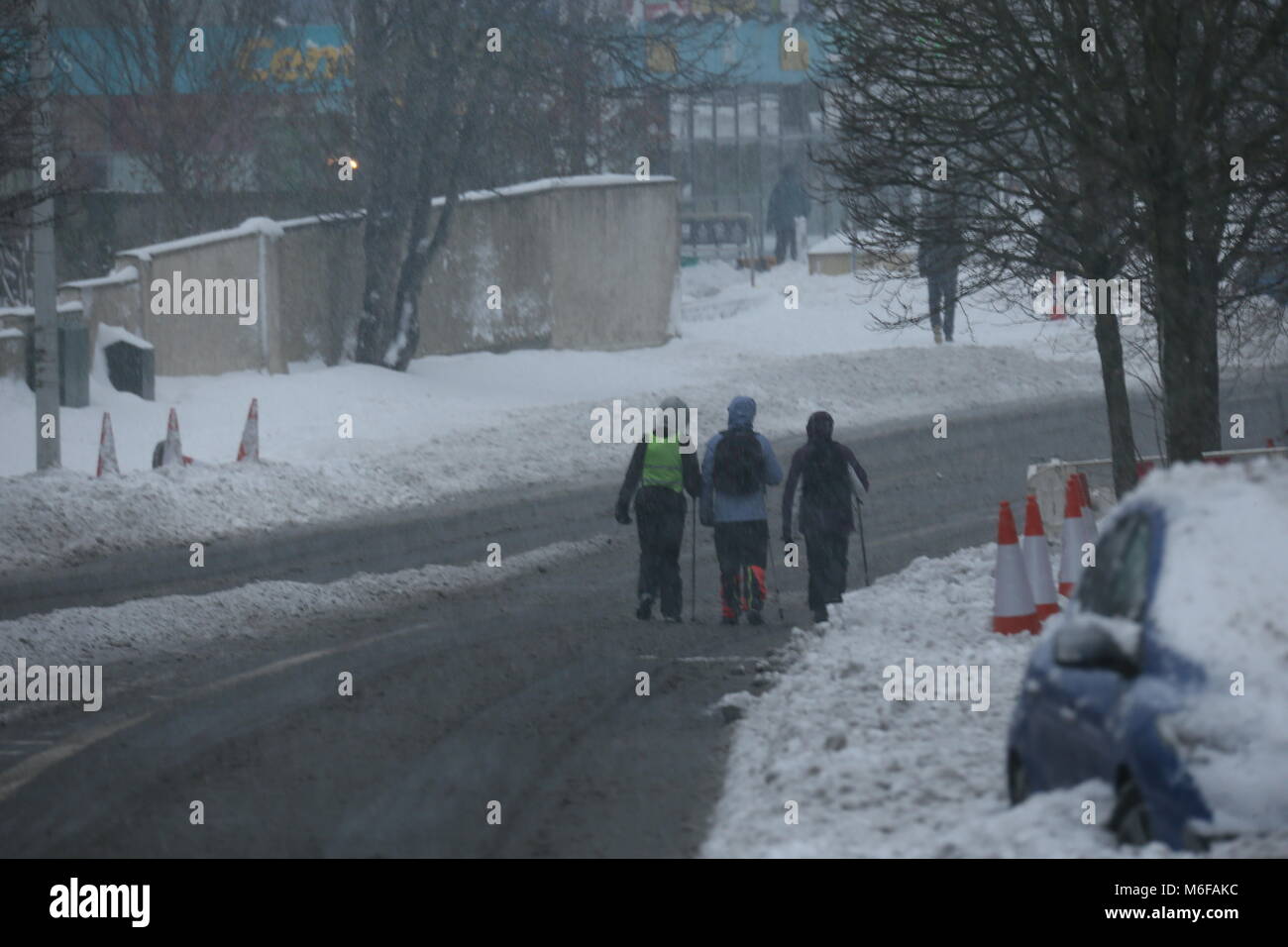 Dublin, Ireland. 3rd March 2018.People on a street in Ballinteer, Dublin after Storm Emma. Image from Dublin, Ireland during the aftermath of Storm Emma. The Irish capital remains covered in snow after several days of heavy snowfall. Credit: Brendan Donnelly/Alamy Live News Stock Photo