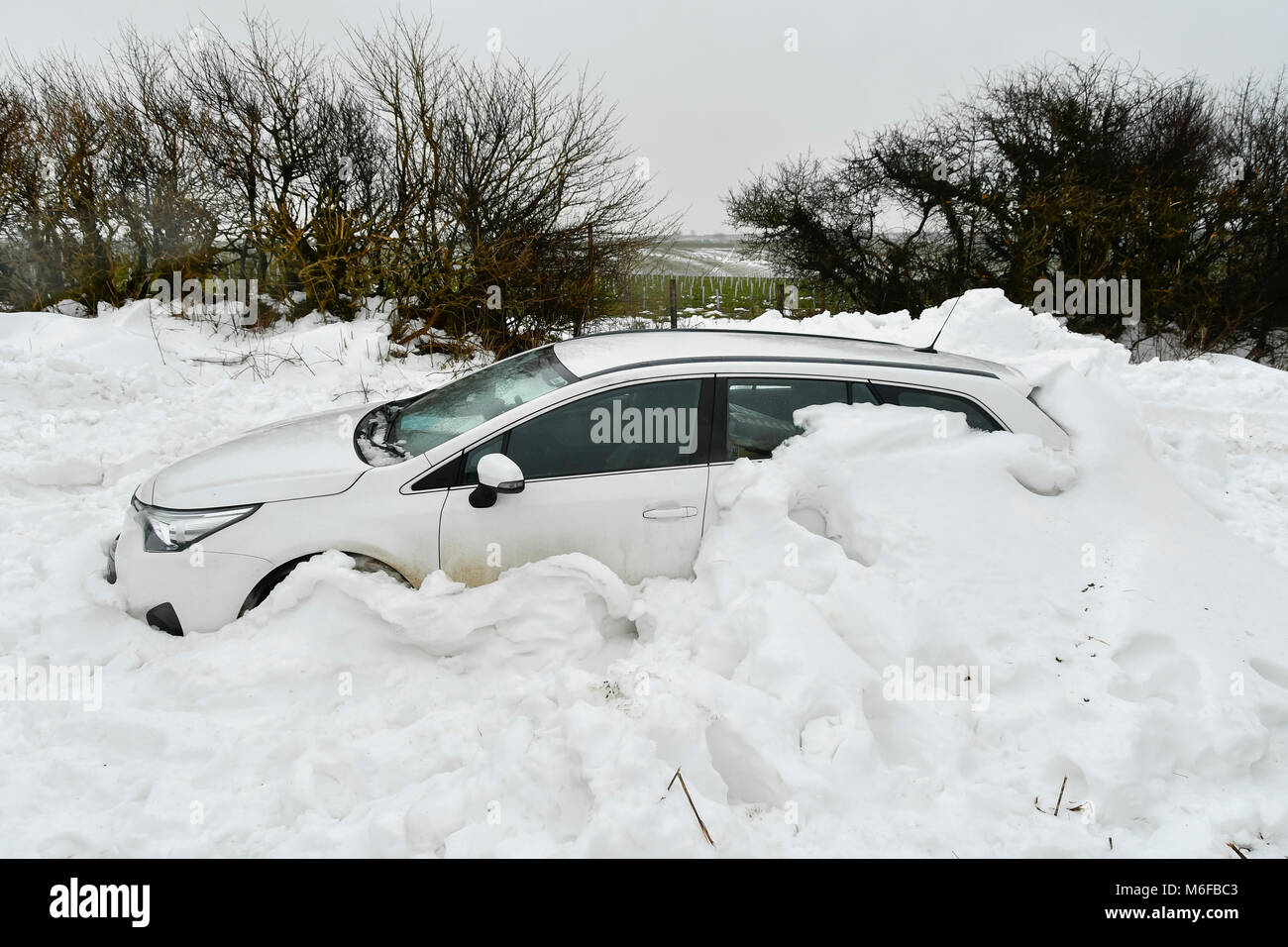 West Compton, Dorset, UK. 3rd March 2018. UK Weather. A white Toyota